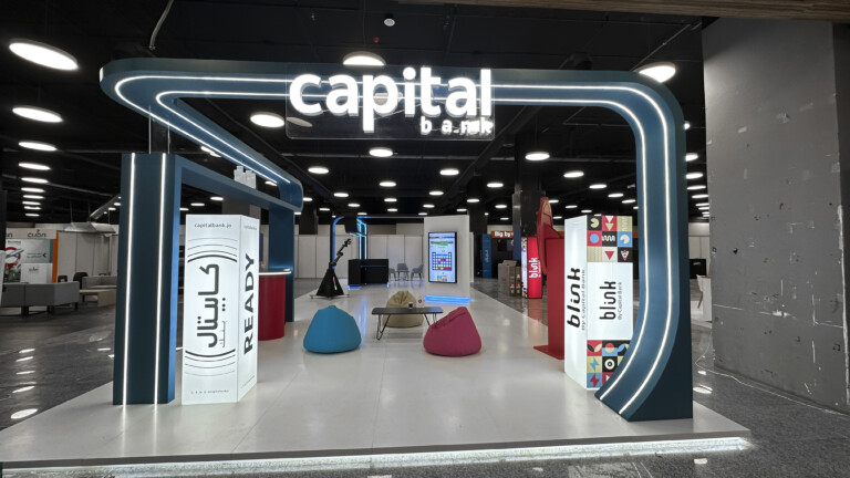 Full Capital Bank booth front with seating area designed by art media