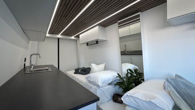 Van interior with kitchen and two beds اdesigned by art media jordan